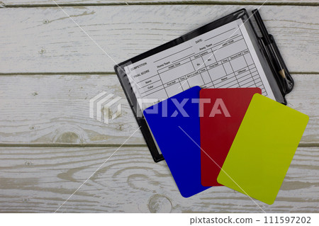 Set of football referee with notepad and blue card 111597202