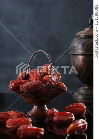 Date fruits in an ancient dish. Dates are a Ramadan dish. Food in Ramadan. 111599088