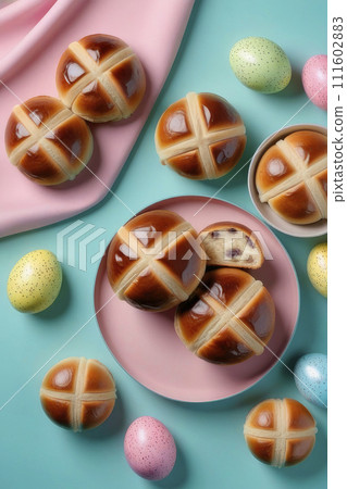 Homemade fresh Easter hot cross buns for easter breakfast on a pastel blue background. 111602883