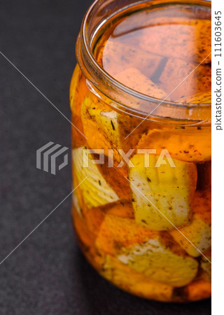Delicious soft white feta cheese with salt, spices and herbs on a dark concrete background 111603645