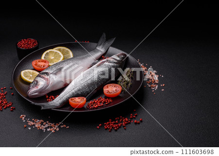 Fresh raw ocean sea bass fish with salt, spices and herbs 111603698