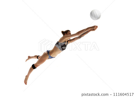 Intense volleyball game moment. Female sportsman, beach volleyball player doing perfect pass in motion against white studio background. 111604517