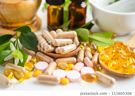 Alternative medicine herbal organic capsule with vitamin E omega 3 fish oil, mineral, drug with herbs leaf natural supplements for healthy good life. Alternative medicine herbal organic capsule with vitamin E omega 3 fish oil, mineral, drug with herbs leaf natural supplements for healthy good life. 111605306