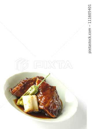 Teriyaki yellowtail, fried shishito and green onions photographed against a white background Teriyaki yellowtail, fried shishito and green onions photographed against a white background 111605401