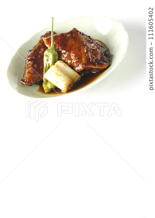 Teriyaki yellowtail, fried shishito and green onions photographed against a white background 111605402