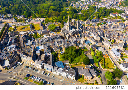 Flight over the city Guingamp and Basilica of Our Lady of Merciful on summer day 111605581