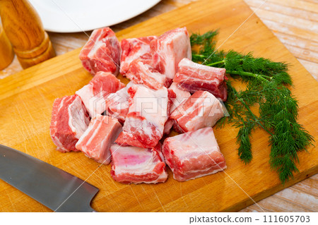 Pieces of fresh uncooked pork ribs Pieces of fresh uncooked pork ribs 111605703