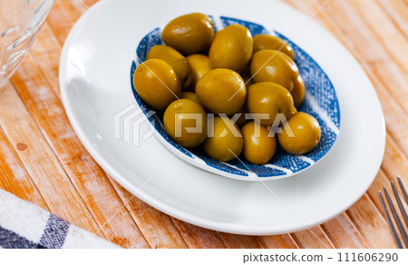 Portion of whole marinated olives Portion of whole marinated olives 111606290
