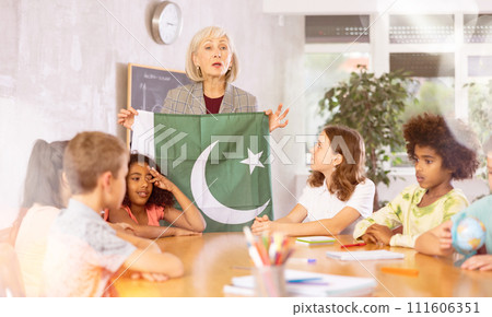 students listen to woman teacher who talks about Pakistan 111606351