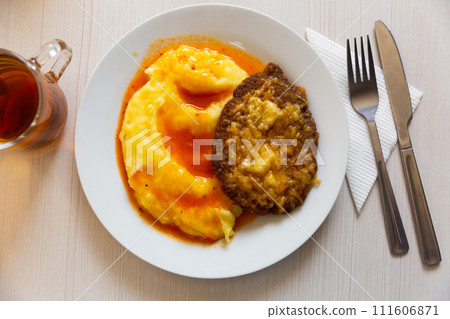 Russian dish - schnitzel with cheese and mashed potatoes. Slavic cuisine Russian dish - schnitzel with cheese and mashed potatoes. Slavic cuisine 111606871
