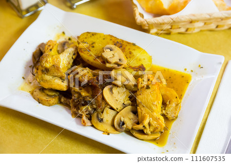 Chicken served with baked potato Chicken served with baked potato 111607535