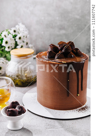 chocolate cake with truffles and tea chocolate cake with truffles and tea 111607742