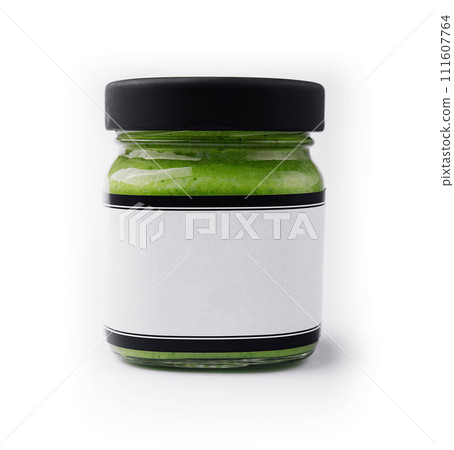 Pesto sauce in a glass jar isolated Pesto sauce in a glass jar isolated 111607764