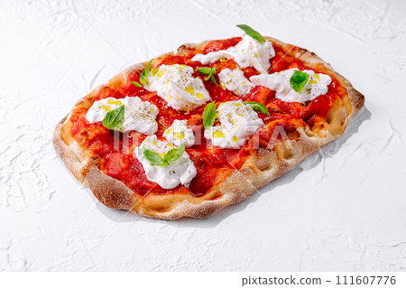 Pizza Margherita on white stone Pizza Margherita on white stone 111607776