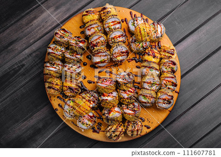 warm tempura sushi roll with seafood warm tempura sushi roll with seafood 111607781
