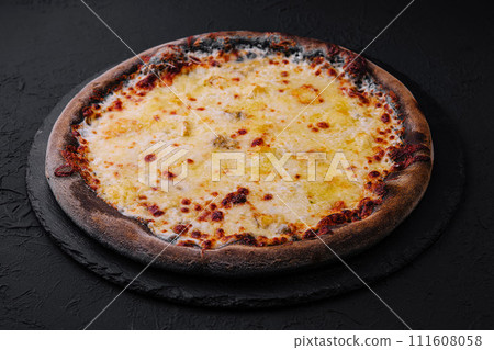 black pizza with cheese on stone black pizza with cheese on stone 111608058