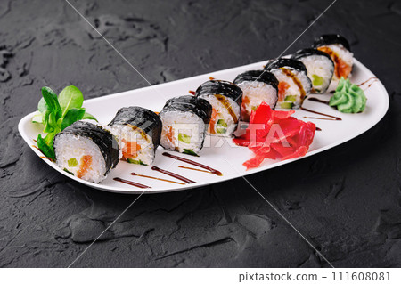 nori sushi rolls with salmon on plate nori sushi rolls with salmon on plate 111608081