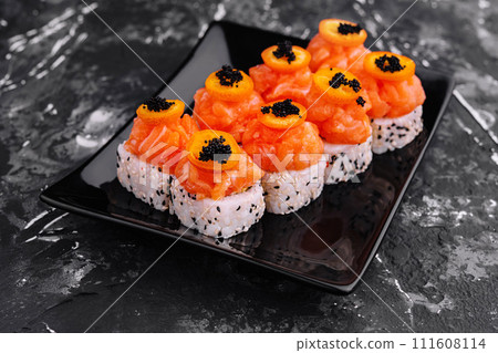 Maki Sushi - Roll topped with Sliced Spicy Salmon Maki Sushi - Roll topped with Sliced Spicy Salmon 111608114