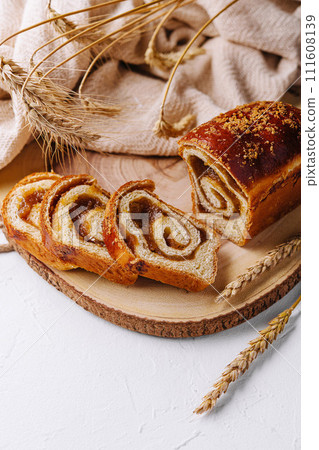 Sweet bun stuffed with apple jam Sweet bun stuffed with apple jam 111608139