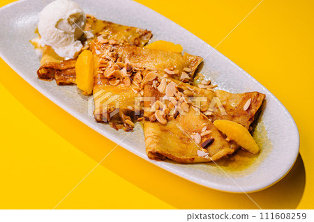 pancakes in honey syrup with mendal and ice cream pancakes in honey syrup with mendal and ice cream 111608259