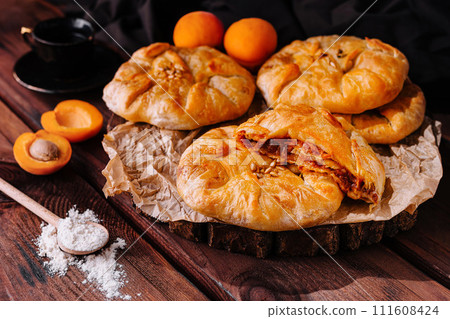 Placinta, traditional Moldovan pastries with peaches Placinta, traditional Moldovan pastries with peaches 111608424