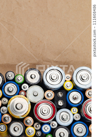 Assorted Used Batteries on a Brown Paper 111608486