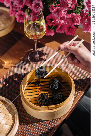 asian dumplings with cuttlefish ink top view 111608834