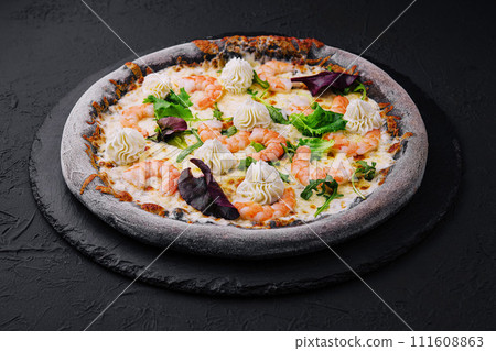 black pizza with shrimp and cream black pizza with shrimp and cream 111608863