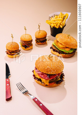 large and mini burgers with fries large and mini burgers with fries 111608907