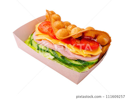 Belgian waffles with ham, cheese and salad on box 111609257