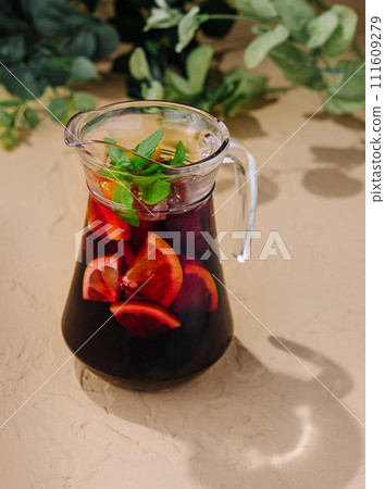 Full jug of pomegranate juice with lemon 111609279
