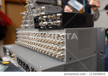 Commutation panel of telecommunication video switcher broadcast for TV channel translation rear view Commutation panel of telecommunication video switcher broadcast for TV channel translation rear view 111609643
