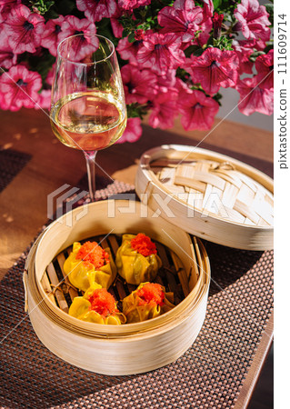 Japanese gyoza or dumplings snack and wine 111609714