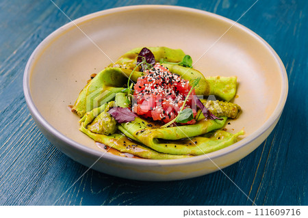 Delicious spinach crepes with tomato salsa 111609716
