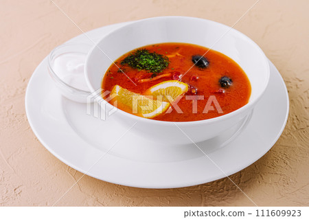 soup solyanka closeup in a bowl soup solyanka closeup in a bowl 111609923