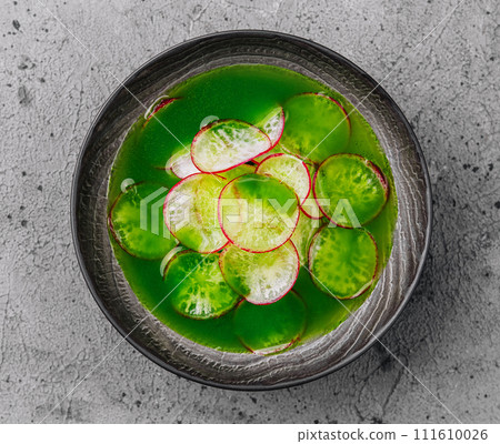 Summer cold soup - okroshka in a ceramic bowl 111610026