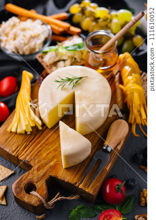 Cheese plate with variety of cheese top view 111610052