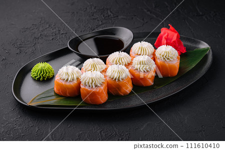 Philadelphia Sushi with Philadelphia Cheese on Black Asian Plate Philadelphia Sushi with Philadelphia Cheese on Black Asian Plate 111610410