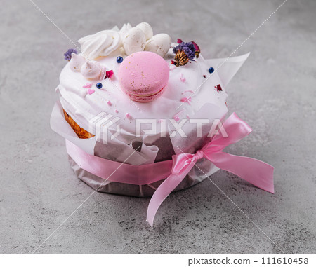 Easter cake decorated with meringues and macarons 111610458