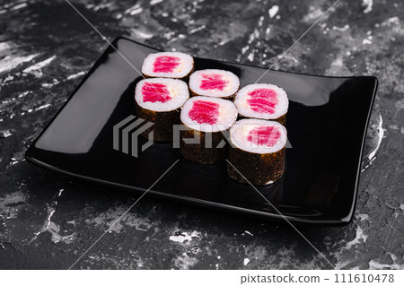 Tuna Maki Sushi on Black Stone Plate Tuna Maki Sushi on Black Stone Plate 111610478