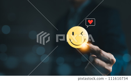 Mental Health Day concept. Hand holding a smiley face icon that depicts happy and giving a heart of love in the message box. positive thinking, Take care of your mental health, Customer satisfaction, 111610734