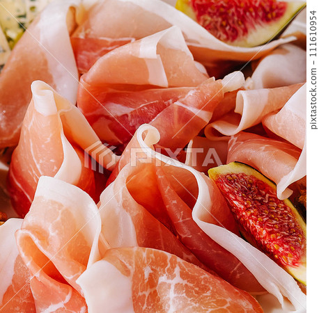 Italian antipasto with prosciutto and fruits 111610954