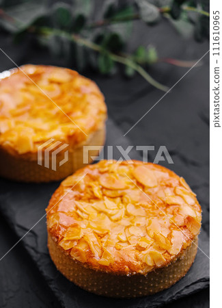 Almond muffins on black board 111610965