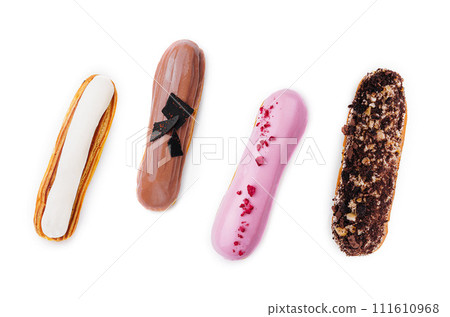 different types of French eclairs on a white background 111610968