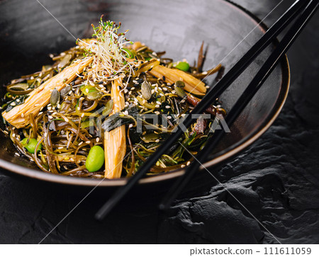 Spicy dish, noodles with meat and vegetables in wok pan 111611059