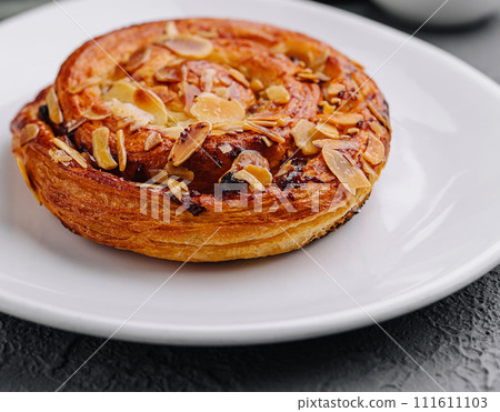 Delicious homemade bakery with almonds and raisins 111611103