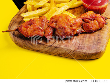 fried pork barbecue with French fries fried pork barbecue with French fries 111611168