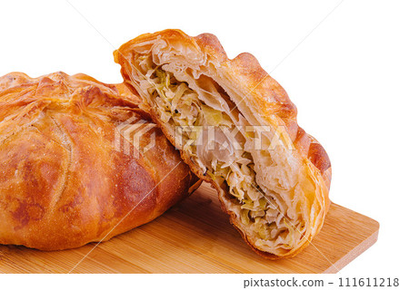 Baking puff pastry with fresh cabbage on wooden Baking puff pastry with fresh cabbage on wooden 111611218
