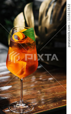 Glass of Aperol Spritz cocktail on the table Glass of Aperol Spritz cocktail on the table 111611632
