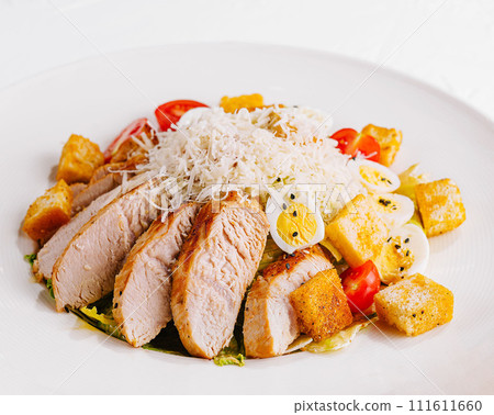 Fresh caesar salad in white plate 111611660